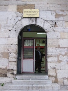 The olive oil shop in November of 2010, note the placement of the sign and the image in the stone right below it.